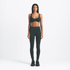 NikeSKIMS MATTE SHAPING SCOOP BRA | DARK TEAL ON A MODEL FRONT VIEW @ | FOCUS: 0.0, 1.0, 0.9