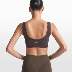 NikeSKIMS RIBBED SEAMLESS SCOOP BRA | PHOENIX/TRUFFLE ON A MODEL FRONT VIEW @ | FOCUS: 0.0, 1.0, 0.9