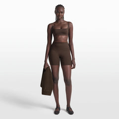 NikeSKIMS MATTE MICRO BRA | DARK SEPIA ON A MODEL FRONT VIEW @ | FOCUS: 0.0, 1.0, 0.9