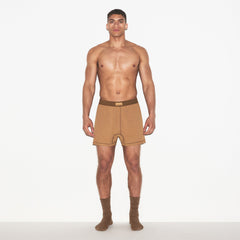 SKIMS COTTON MENS KNIT BOXER | RUSSET ON A MODEL FRONT VIEW | FOCUS: 0.0, 1.0, 0.9