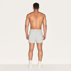 SKIMS COTTON MENS KNIT BOXER 3-PACK | HEATHER MULTI ON A MODEL FRONT VIEW | FOCUS: 0.0, 1.0, 0.9