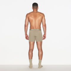 SKIMS SPORT MENS 5 INCH BOXER BRIEF 3-PACK | DUNE MULTI ON A MODEL FRONT VIEW | FOCUS: 0.0, 1.0, 0.9