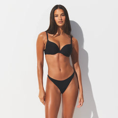 SIGNATURE SWIM THONG BIKINI BOTTOM | ONYX ON A MODEL FRONT VIEW @ | FOCUS: 0.0, 1.0, 0.9
