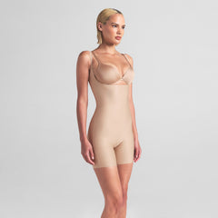 SKIMS BODY CORE SCULPT OPEN BUST MID THIGH BODYSUIT | CLAY ON A MODEL SIDE VIEW