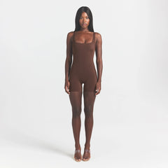COOL SHAPEWEAR MID THIGH BODYSUIT | COCOA ON A MODEL FRONT VIEW @ | FOCUS: 0.0, 1.0, 0.9