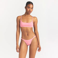 LIGHTWEIGHT COTTON LOGO PICOT STRING BIKINI | MELON TONAL ON A MODEL SIDE VIEW @ | FOCUS: 0.0, 1.0, 0.9
