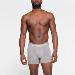 SKIMS STRETCH MENS 3" BOXER BRIEF 3-PACK WORN BY A MODEL IN FRONT VIEW | FOCUS: 0.0, 1.0, 0.9