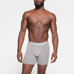 SKIMS STRETCH MENS 5" BOXER BRIEF 3-PACK WORN BY A MODEL IN FRONT VIEW