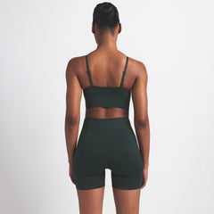 NikeSKIMS MATTE 5" BIKER SHORT | DARK TEAL ON A MODEL SIDE VIEW @ | FOCUS: 0.0, 1.0, 0.9