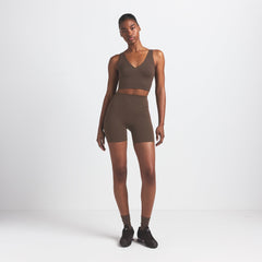 NikeSKIMS MATTE 5" BIKER SHORT | DARK SEPIA ON A MODEL FRONT VIEW @ | FOCUS: 0.9, 0.1, 0.7