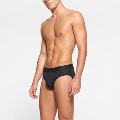 SKIMS STRETCH MENS BRIEF 3-PACK WORN BY A MODEL IN SIDE VIEW