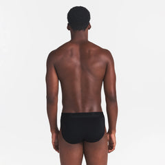 SKIMS STRETCH MENS BRIEF | OBSIDIAN ON A MODEL BACK VIEW