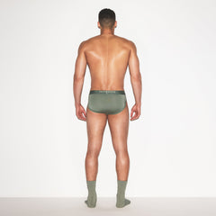 SKIMS STRETCH MENS BRIEF 3-PACK | LAUREL MULTI ON A MODEL FRONT VIEW | FOCUS: 0.0, 1.0, 0.9
