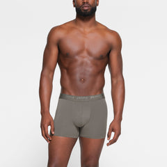 SKIMS STRETCH MENS 3" BOXER BRIEF 3-PACK WORN BY A MODEL IN FRONT VIEW | FOCUS: 0.0, 1.0, 0.9