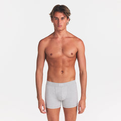 SKIMS COTTON MENS 3" BOXER BRIEF | LIGHT HEATHER GREY ON A MODEL FRONT VIEW @ | FOCUS: 0.0, 1.0, 0.9