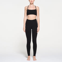 OUTDOOR HIGH-WAISTED LEGGING | ONYX ON A MODEL FRONT VIEW