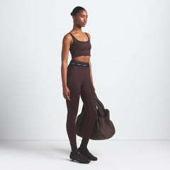NikeSKIMS SHINE BONDED WAIST 26" LEGGING | PHOENIX ON A MODEL FRONT VIEW