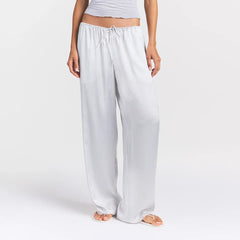 WOVEN SHINE LACE PANT | SILVER TRIPLE PINSTRIPE ON A MODEL SIDE VIEW @ | FOCUS: 0.0, 1.0, 0.9