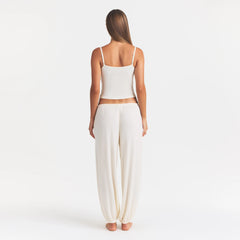 SKIMS SLEEP JOGGER | ECRU ON A MODEL FRONT VIEW @ | FOCUS: 0.0, 1.0, 0.9