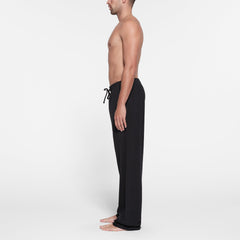 JERSEY LOUNGE MENS RELAXED STRAIGHT LEG PANT | OBSIDIAN ON A MODEL SIDE VIEW @ | FOCUS: 0.9, 0.1, 0.7