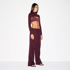 NikeSKIMS MATTE TRICOT SIDE SNAPS PANT | CURRANT ON A MODEL SIDE VIEW @ | FOCUS: 0.0, 1.0, 0.9