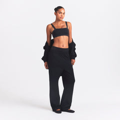 NikeSKIMS MATTE TRICOT SIDE SNAPS PANT | OBSIDIAN ON A MODEL FRONT VIEW @ | FOCUS: 0.0, 1.0, 0.9