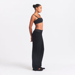 NikeSKIMS MATTE TRICOT SIDE SNAPS PANT | OBSIDIAN ON A MODEL SIDE VIEW @ | FOCUS: 0.0, 1.0, 0.9