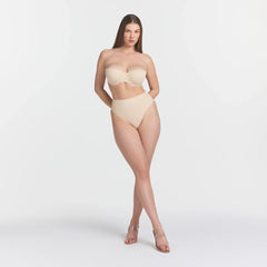 SMOOTHING INTIMATES STRAPLESS BRA | SAND ON A MODEL FRONT VIEW @ | FOCUS: 0.0, 1.0, 0.9