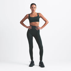 NikeSKIMS MATTE SCOOP NECK BRA | DARK TEAL ON A MODEL FRONT VIEW @ | FOCUS: 0.0, 1.0, 0.9