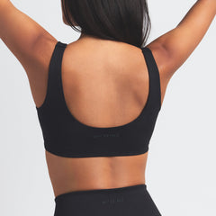 NikeSKIMS MATTE SCOOP NECK BRA | OBSIDIAN ON A MODEL BACK VIEW @ | FOCUS: 0.0, 1.0, 0.9