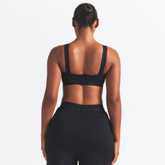 NikeSKIMS MATTE WIDE STRAP BRA | OBSIDIAN ON A MODEL BACK VIEW @ | FOCUS: 0.0, 1.0, 0.9