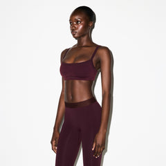 NikeSKIMS VINTAGE SEAMLESS CAMI BRA | CURRANT ON A MODEL FRONT VIEW @ | FOCUS: 0.0, 1.0, 0.9
