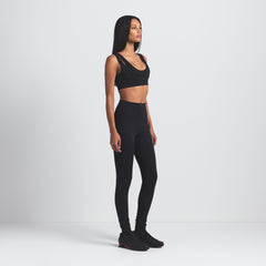 NikeSKIMS MATTE DOUBLE STRAP SCOOP BRA | OBSIDIAN ON A MODEL SIDE VIEW @ | FOCUS: 0.0, 1.0, 0.9