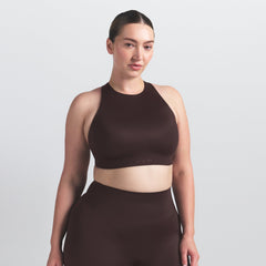 NikeSKIMS SHINE HIGH NECK BRA | PHOENIX ON A MODEL SIDE VIEW