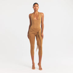 CUPRO JERSEY HALTER BODYSUIT | ALMOND ON A MODEL FRONT VIEW @ | FOCUS: 0.0, 1.0, 0.9