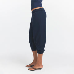 DRAPEY FRENCH TERRY CROPPED JOGGER | NAVY ON A MODEL SIDE VIEW @ | FOCUS: 0.0, 1.0, 0.9