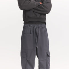 WOVEN MENS CARGO PANT | ASH ON A MODEL SIDE VIEW @ | FOCUS: 0.0, 1.0, 0.9