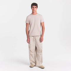 WOVEN MENS CARGO PANT | STONE ON A MODEL FRONT VIEW @ | FOCUS: 0.0, 1.0, 0.9