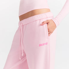 COTTON FLEECE STRAIGHT LEG PANT WITH EMBOSSED LOGO | CHERRY BLOSSOM ON A MODEL SIDE VIEW @ | FOCUS: 0.0, 1.0, 0.9