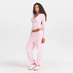 COTTON FLEECE JOGGER WITH EMBOSSED LOGO | CHERRY BLOSSOM ON A MODEL FRONT VIEW @ | FOCUS: 0.0, 1.0, 0.9