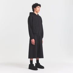 FLEECE LOUNGE MENS RELAXED LONG SHORT | WASHED ONYX ON A MODEL FRONT VIEW @ | FOCUS: 0.0, 1.0, 0.9