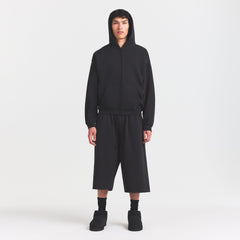 FLEECE LOUNGE MENS RELAXED LONG SHORT | WASHED ONYX ON A MODEL FRONT VIEW @ | FOCUS: 0.0, 1.0, 0.9