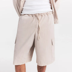 WOVEN MENS RELAXED CARGO SHORT | STONE ON A MODEL SIDE VIEW @ | FOCUS: 0.0, 1.0, 0.9