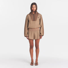 WOVEN COTTON FLUTTER SHORT | DESERT ON A MODEL FRONT VIEW @ | FOCUS: 0.0, 1.0, 0.9
