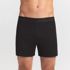 SKIMS STRETCH MENS KNIT BOXER | OBSIDIAN ON A MODEL FRONT VIEW @ | FOCUS: 0.0, 1.0, 0.9