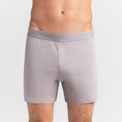 SKIMS STRETCH MENS KNIT BOXER | OYSTER ON A MODEL FRONT VIEW @ | FOCUS: 0.0, 1.0, 0.9