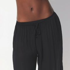 SHEER COVER-UPS PANT | OBSIDIAN ON A MODEL SIDE VIEW @ | FOCUS: 0.0, 1.0, 0.9