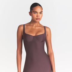 SKIMS BODY MIDI DRESS | RAISIN ON A MODEL SIDE VIEW @