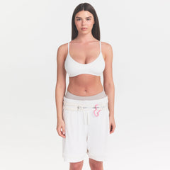 NikeSKIMS MATTE MICRO SCOOP BRA | IVORY ON A MODEL