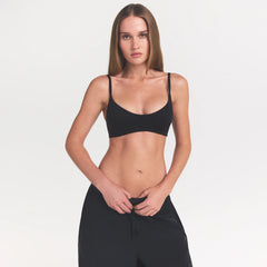 NikeSKIMS MATTE MICRO SCOOP BRA | OBSIDIAN ON A MODEL FRONT VIEW @ | FOCUS: 0.0, 1.0, 0.9
